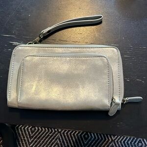 Joy Susan silver wristlet purse with credit card inserts and pocket. GUC.